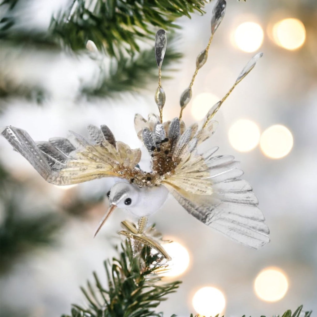 hummingbird decoration clipped on a tree