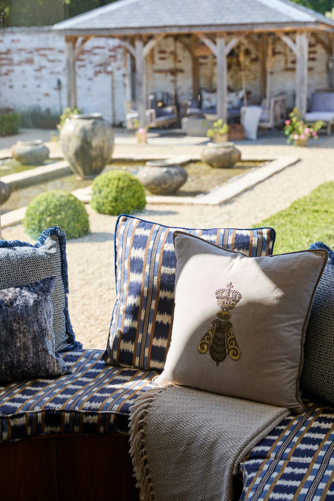 Image of reading nook with outdoor view decorated with blue cusshions