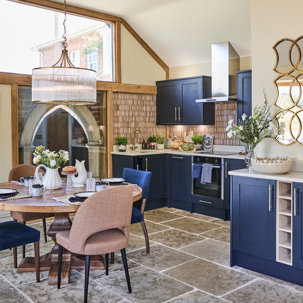 Blue and cream kitchen scene with cream bobble bowl glug jug white urchin jugs and stone floor